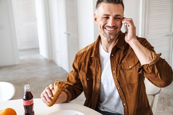 man on phone eating - Photo Gallery 3