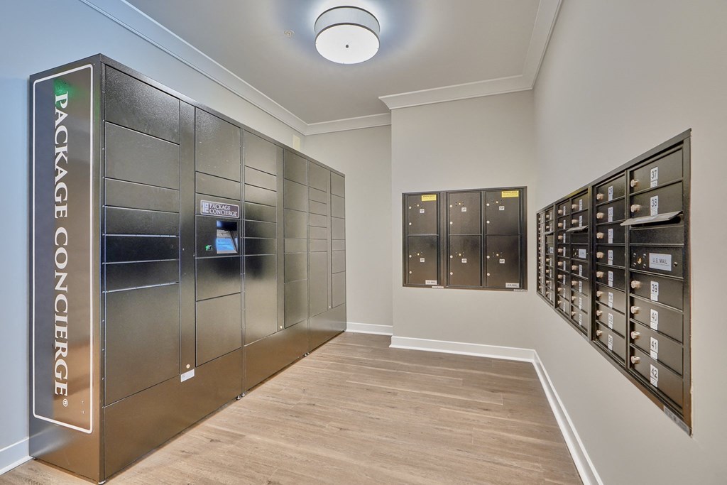 A room with a vaulted ceiling and a wall of safe deposit boxes.