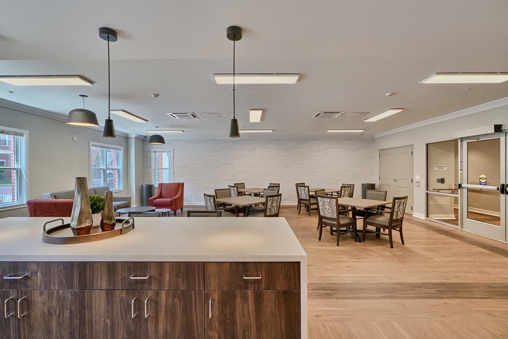 A modern kitchen with a dining table and chairs.