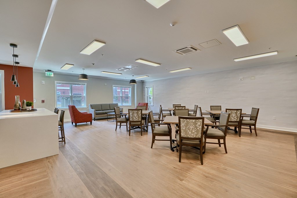 A room with wooden floors and furniture.