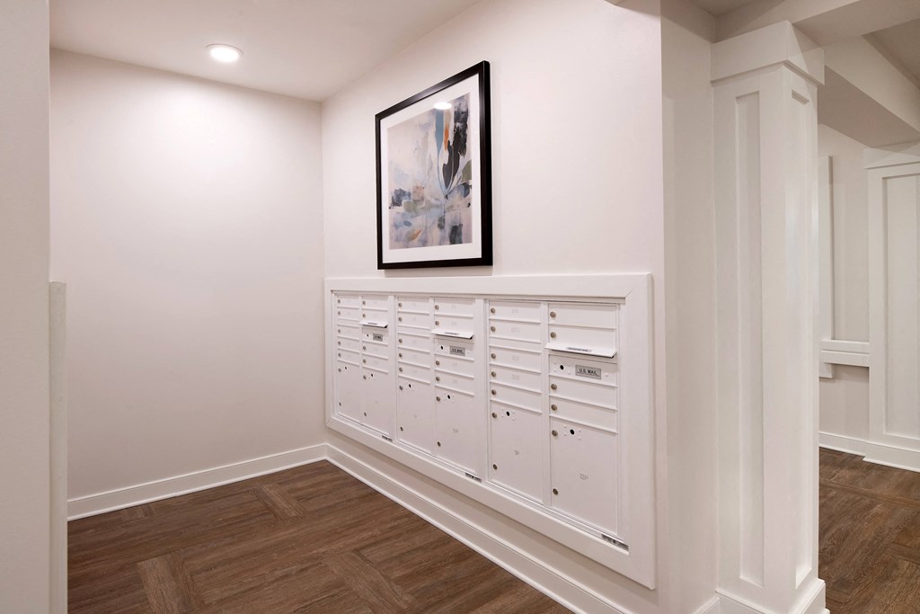 a row of white chests of drawers in a white room