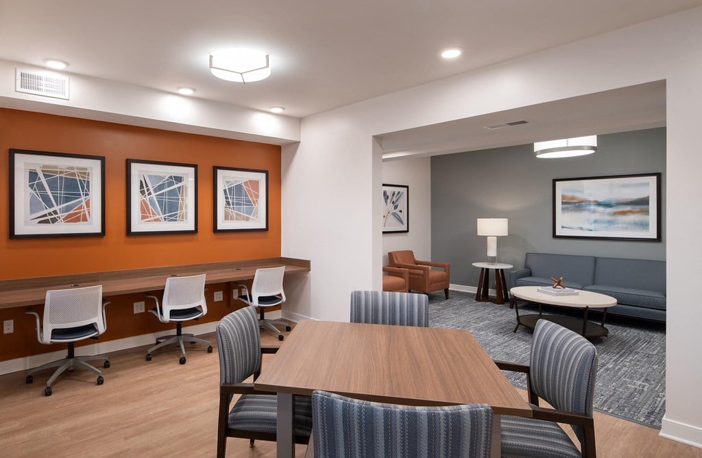 a conference room with a table and chairs
