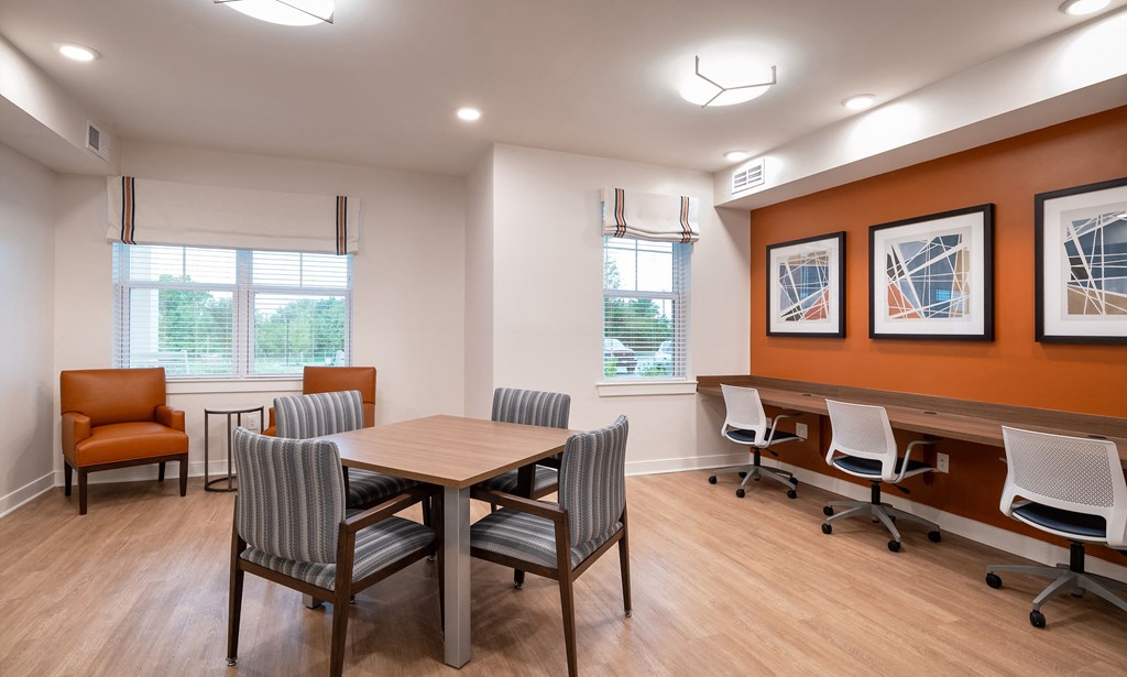 a conference room with a wooden table and chairs