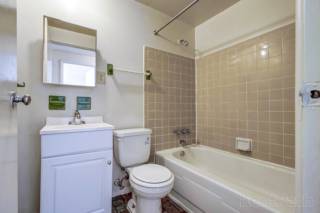 bathroom with shower and tub