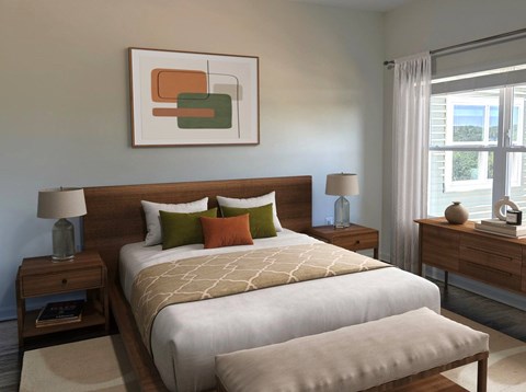 A bedroom with a large bed, two nightstands, and a painting on the wall.