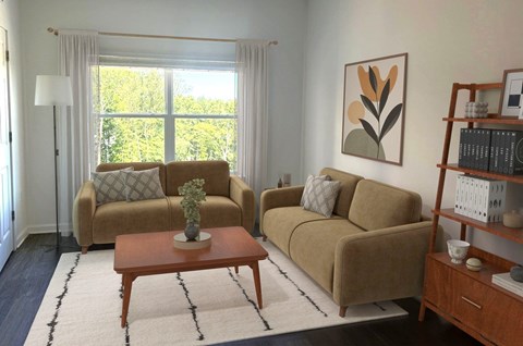 A living room with a couch, chair, and a table with a plant on it.