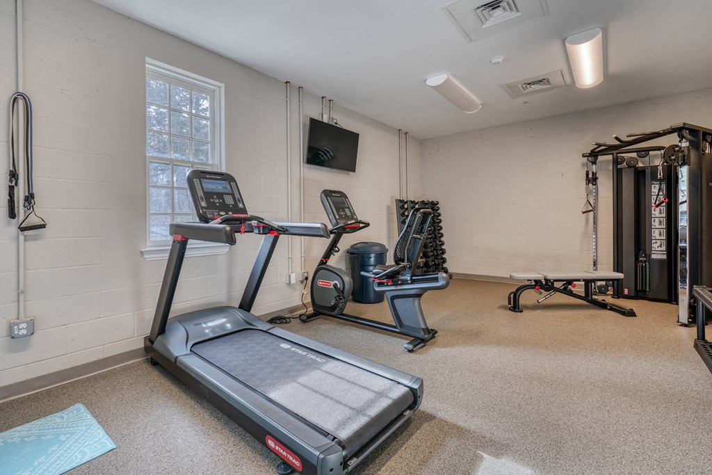 the gym with treadmills and weights at the preserve at greatstone