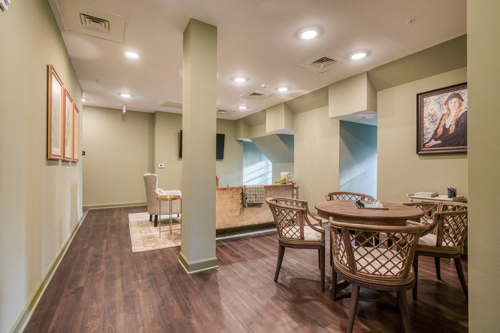 a dining room with a table and chairs and a couch