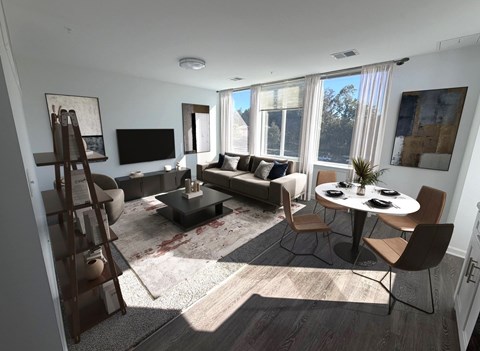 A living room with a couch, chairs, and a television.