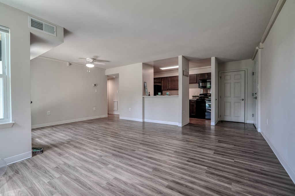 an empty living room and kitchen in a new home