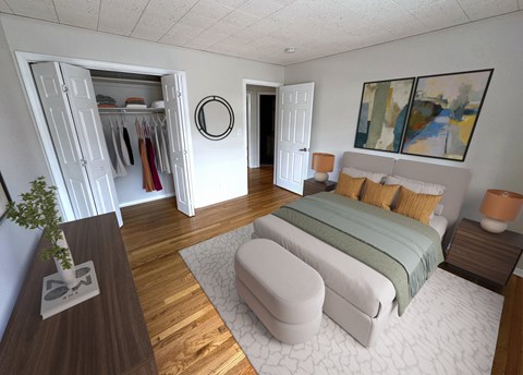 A bedroom with a bed, a wardrobe, and a mirror.