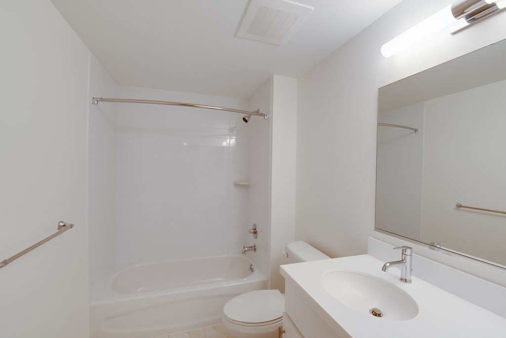 bathroom with shower and tub