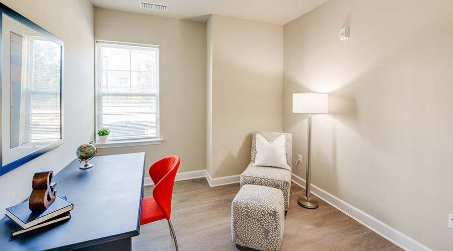 Bedroom with lounge chair and desk