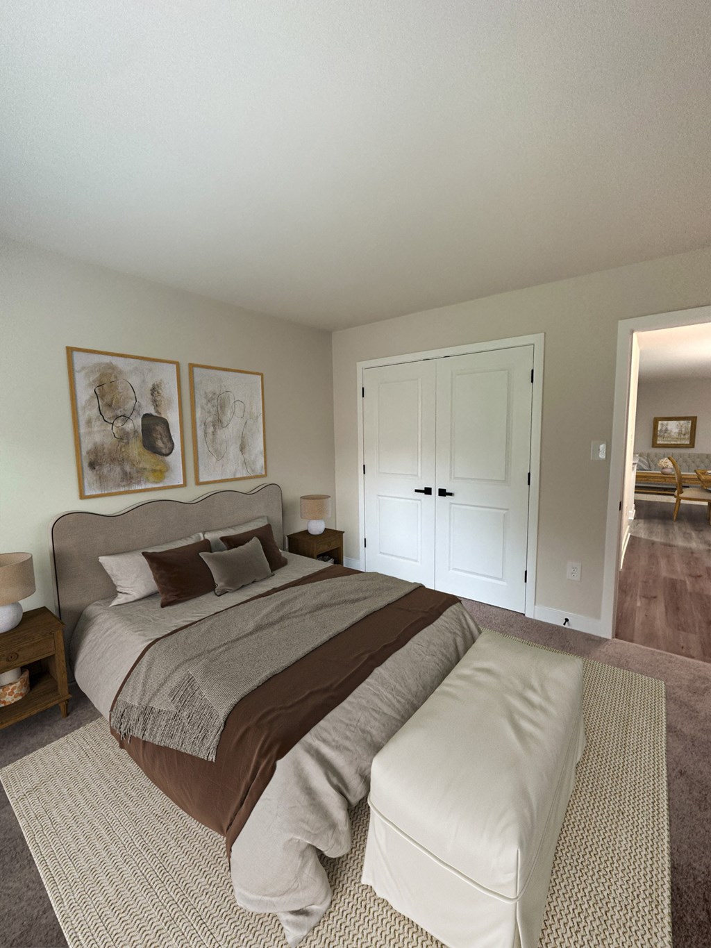 a bedroom with a bed and a door to a bathroom