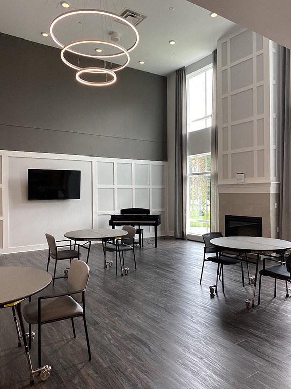 Common area with seating, tv and fireplace