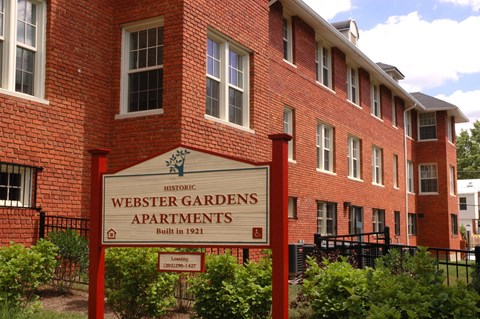 Exterior of building with sign that says Webster Garden Apartments