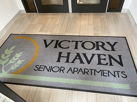 Victory Haven doormat with logo