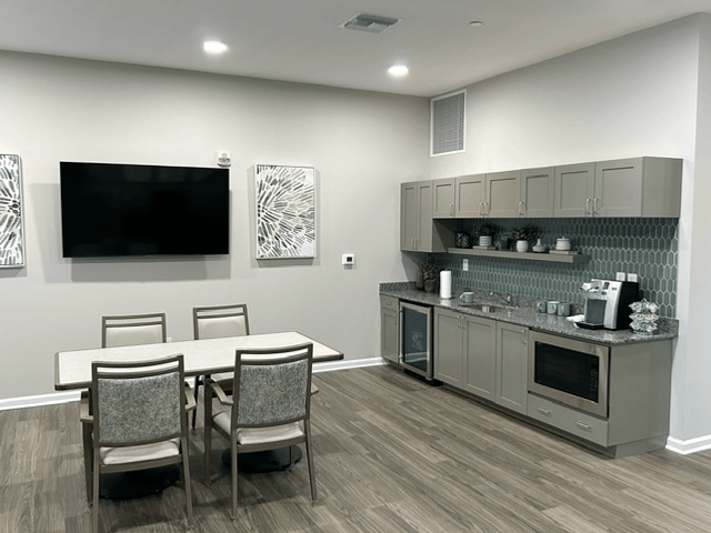 a modern kitchen with a dining area royalty free illustration