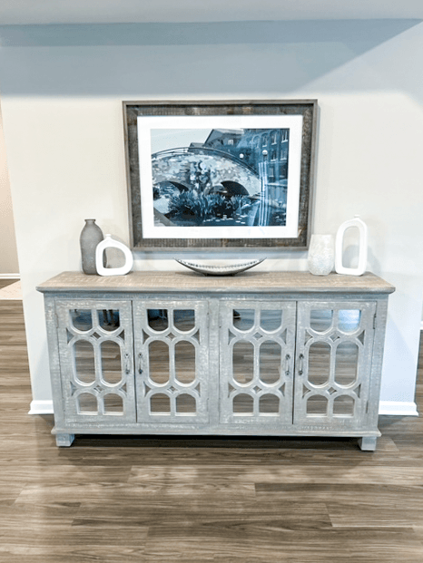 a blue cabinet with a picture on top of it