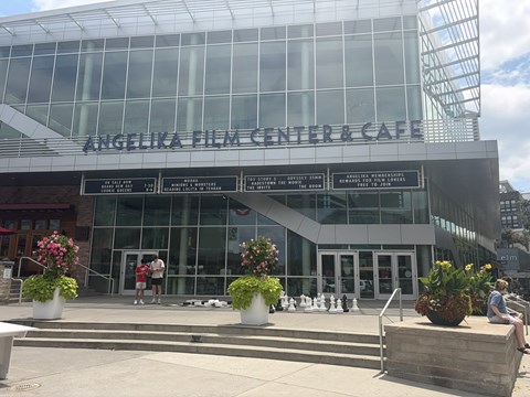 The exterior of the Angelika Film Center & Cafe with people walking in front.