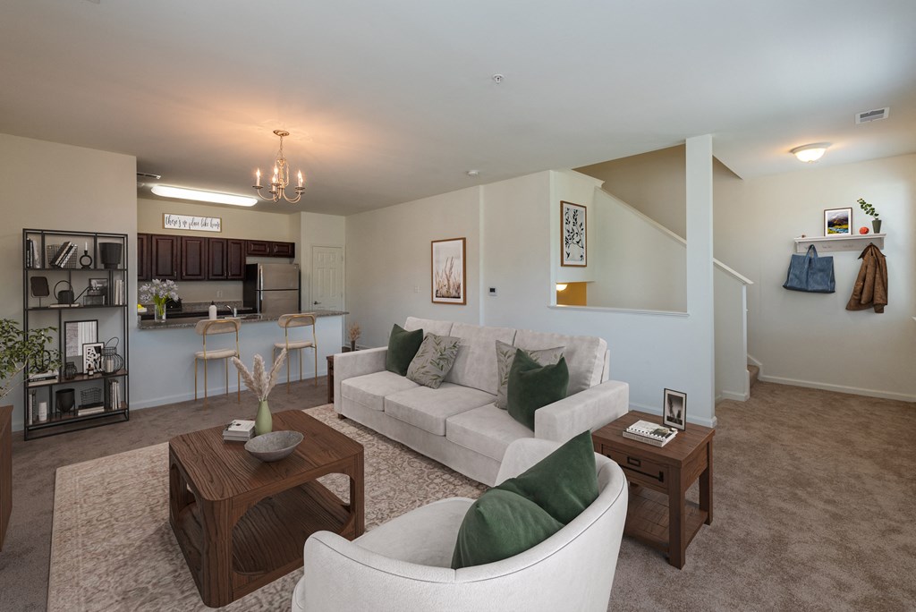A living room with a white couch and a coffee table.