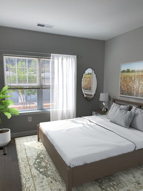 a bedroom with a bed and two windows