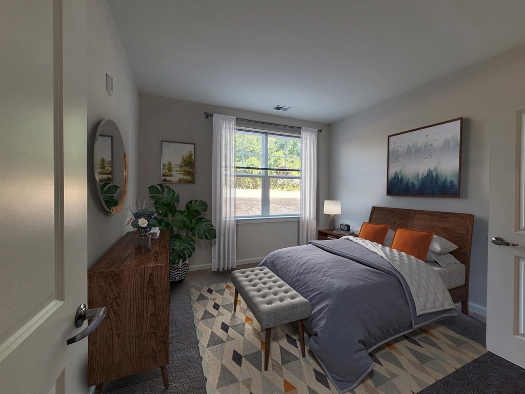 a bedroom with a bed and a dresser and a window