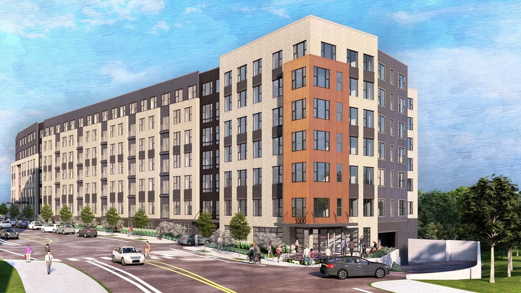 A large building with a parking lot in front of it.