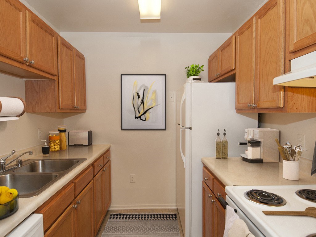 kitchen with wood cabinets and white appliances