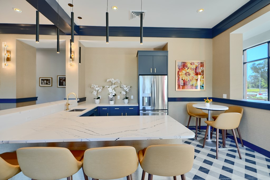 Now leasing senior 1-bedrooms in Baltimore, MD. A kitchen with a marble countertop and a breakfast bar.