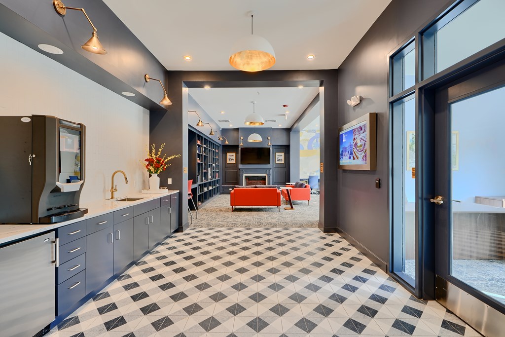 Now leasing senior 1-bedrooms in Baltimore, MD. A kitchen with a black and white checkered floor.