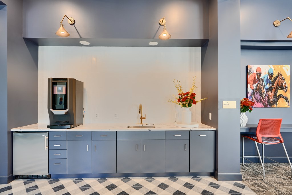 Now leasing senior 1-bedrooms in Baltimore, MD. A kitchen with a checkered floor and a vending machine.