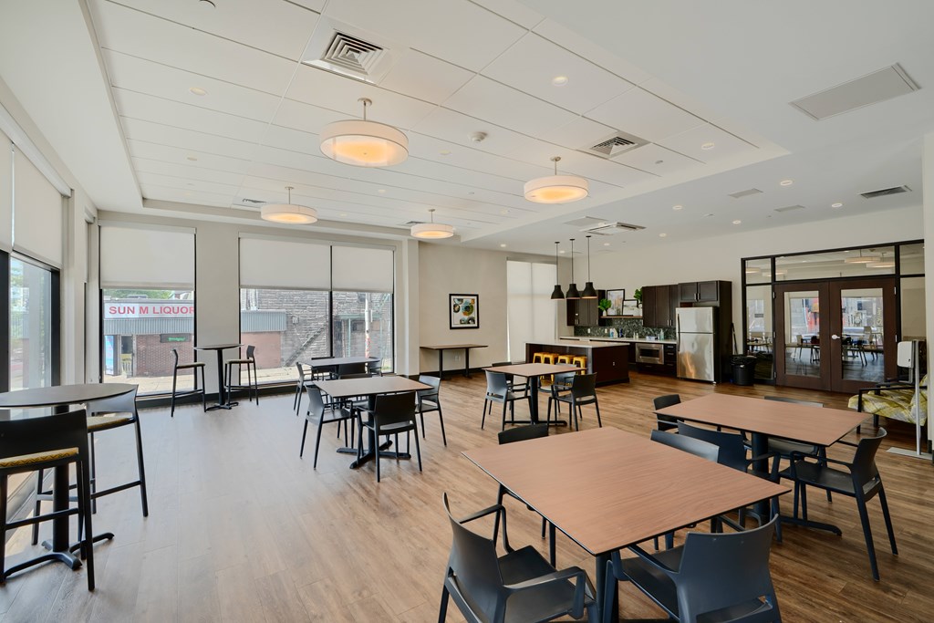 A large room with tables and chairs.