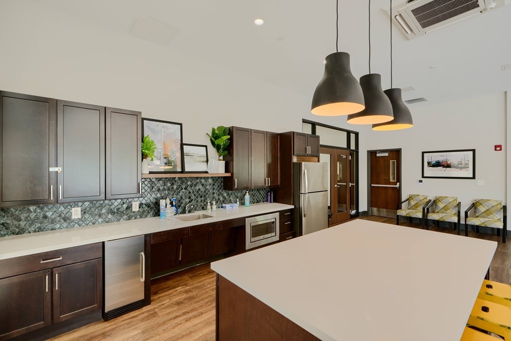 A kitchen with a countertop and a refrigerator.