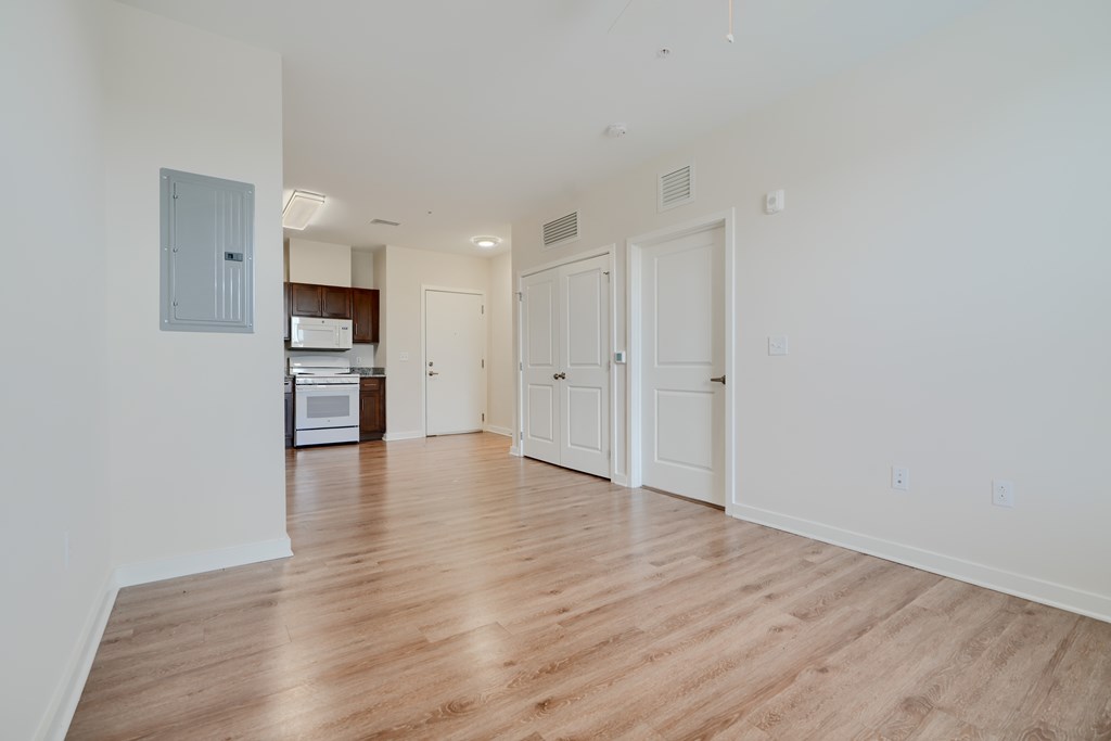 A room with wooden floors and white walls.