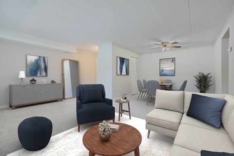 A living room with a blue chair and a white couch.