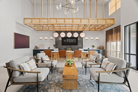 A living room with a wooden coffee table and grey couches.