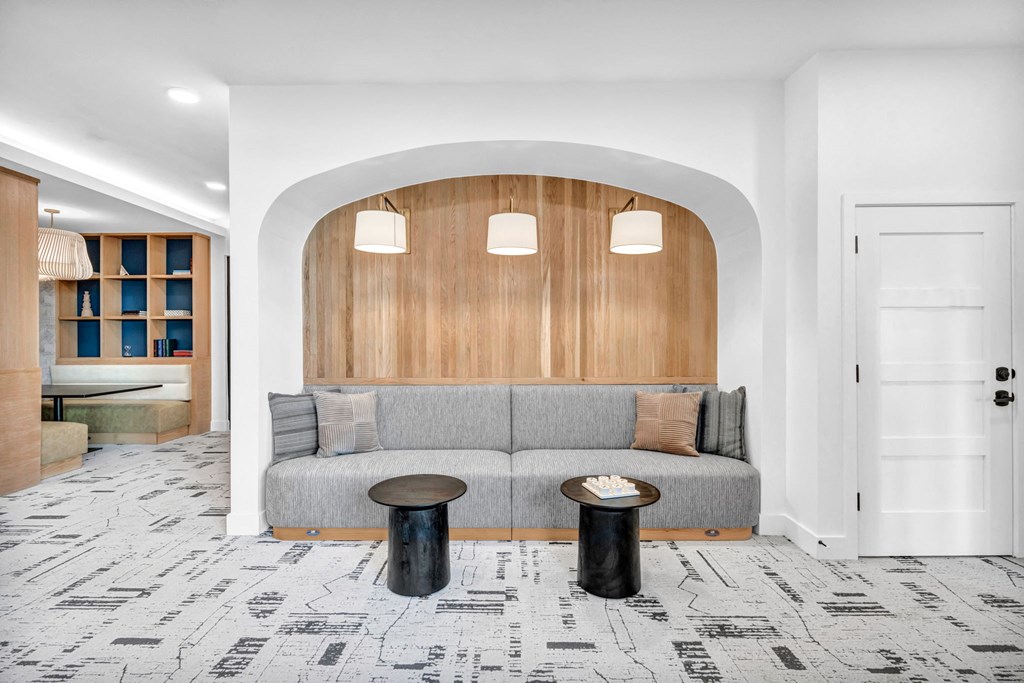 a room with a couch and two tables