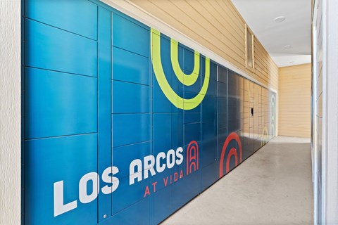 A wall with Los Arcos at Vida written on it.