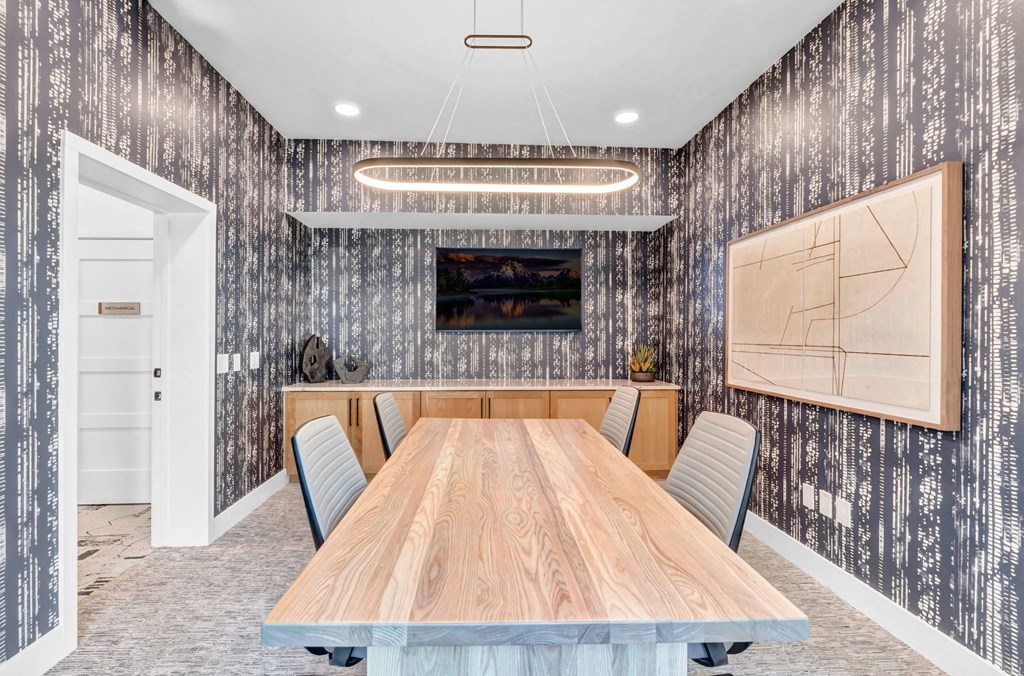 a conference room with a wooden table and chairs