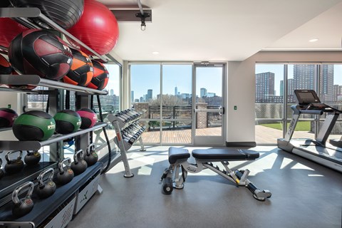 A gym with a view of the city.