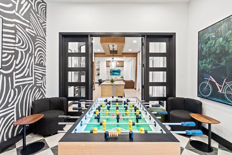 a game room with a foosball table