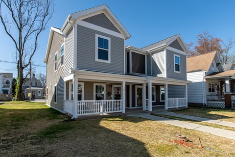 Thoughtfully designed two-story residence featuring a covered front porch, clean lines, and a spacious exterior setting.