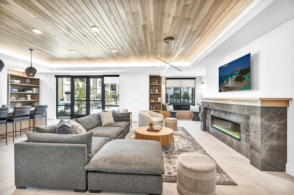 a room with couches and a fireplace