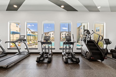 the gym with treadmills and ellipticals