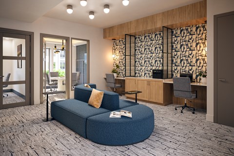 A modern office space with a blue sofa and a patterned wallpaper.