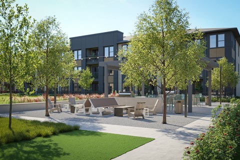 A modern building with a green lawn in front.