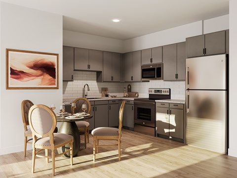 A modern kitchen with a dining table and chairs.