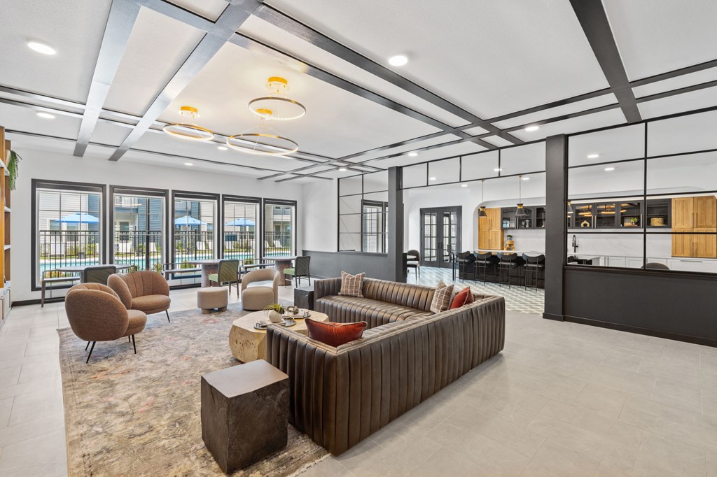 A modern living room with a large sectional sofa and a coffee table.