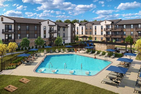 A large swimming pool surrounded by lounge chairs and umbrellas in front of apartment buildings.